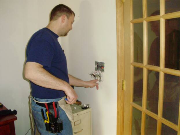 Our licensed electrician team fixing lights.